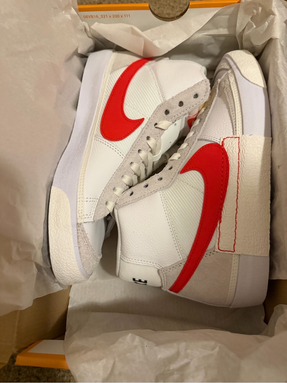 Nike White High-Top Sneakers with Red Swoosh